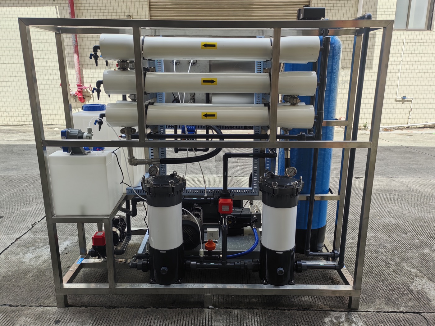 rear view of industrial RO seawater desalination machine with membrane housings and security filters