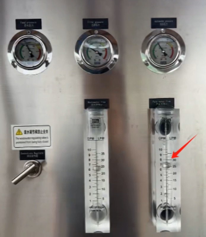 industrial RO machine control panel gauges and flow meter detail